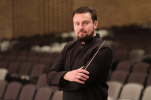 Travis Jürgens, conductor